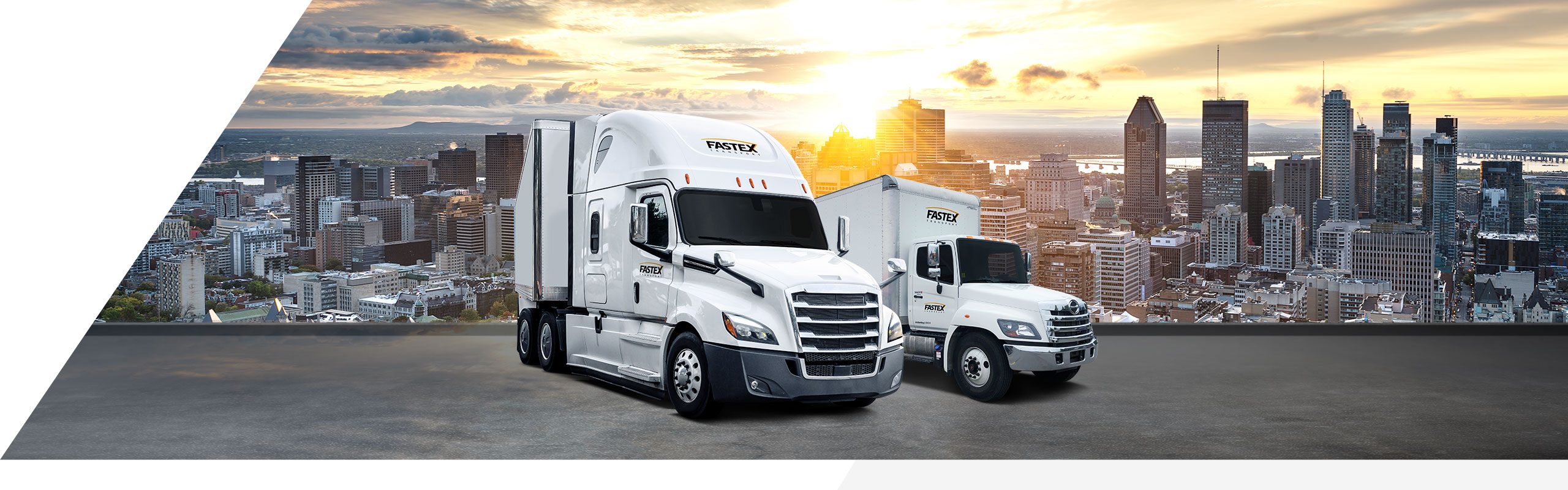 Fastex transport truck and straight truck parked, with city of Montreal in the background.